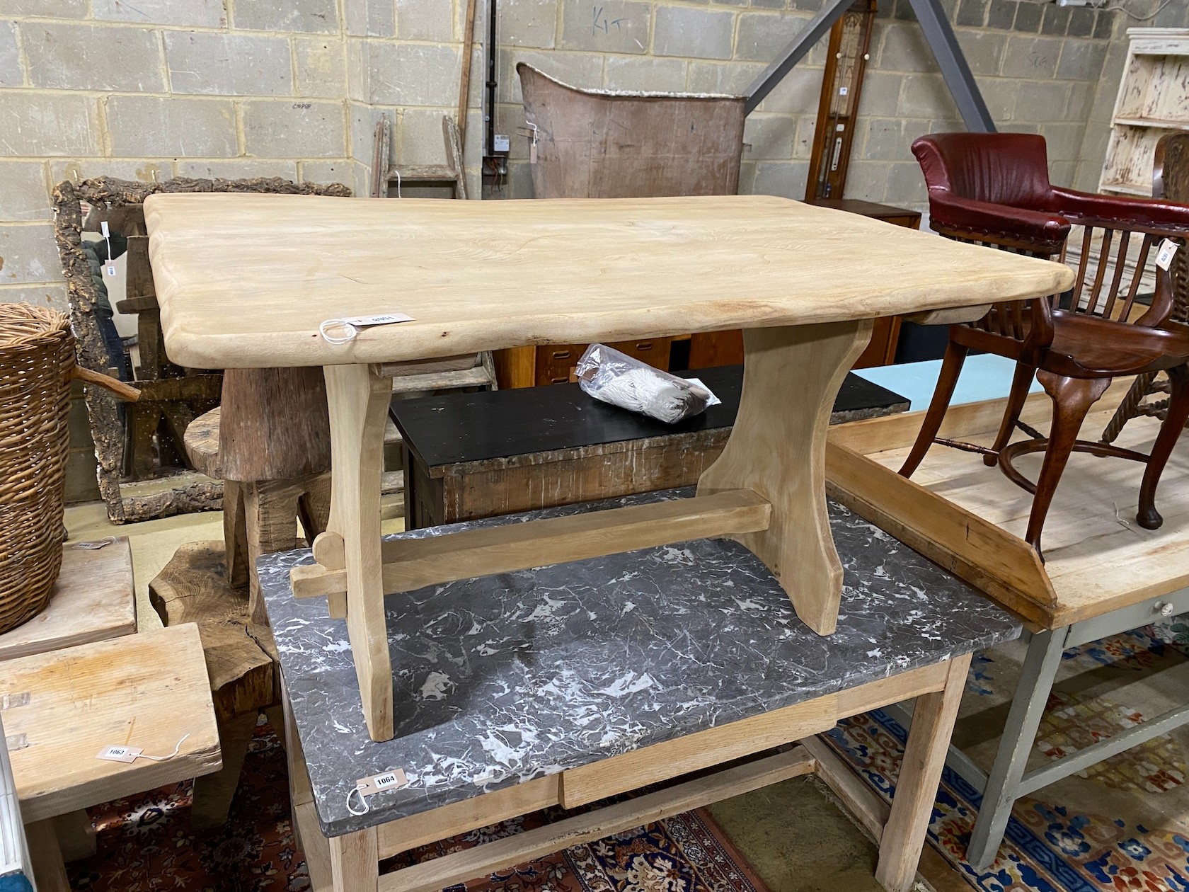 A Provincial bleached oak rectangular waney edge tavern type table, width 136cm, depth 92cm, height 75cm